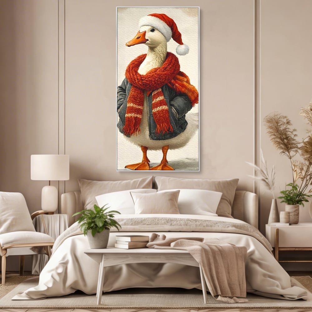 Tablou canvas cu rata imbracata in haine de iarna, in rama de aluminiu argintiu, pe perete intr-un dormitor